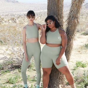 Girlfriend Collective biker shorts in Agave size M